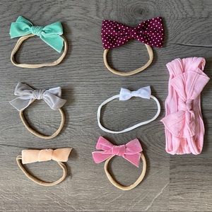 Lot of 7 nylon baby bows and headband